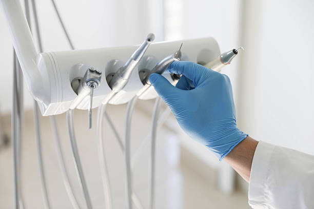 Professional Tooth Extraction technician working in St. Louis city County, MO